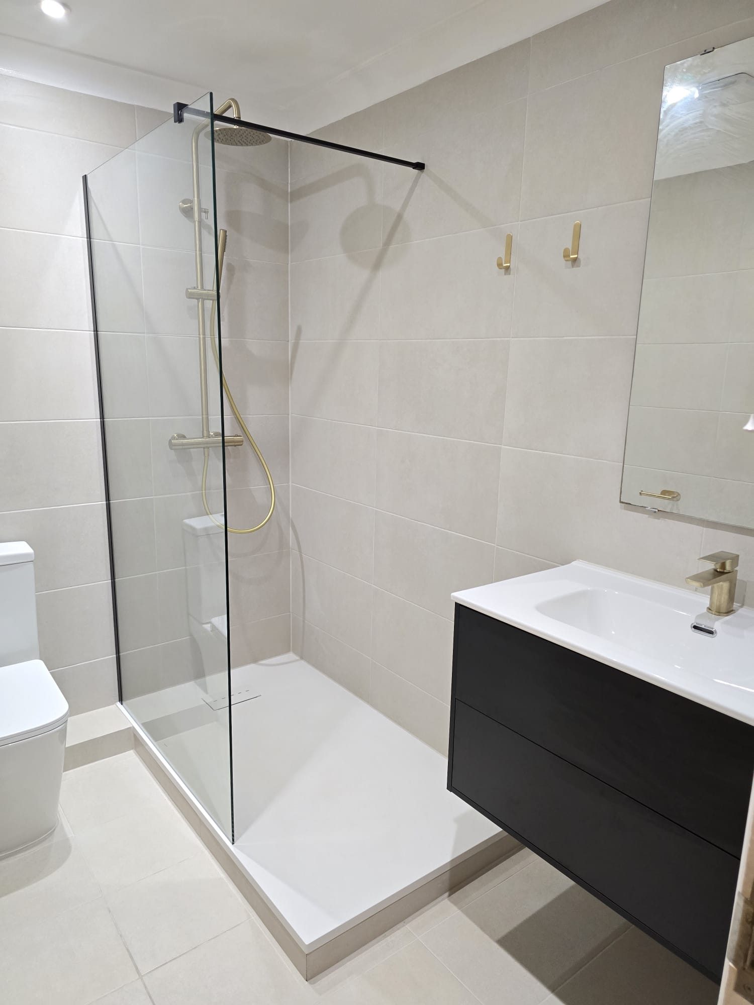 Completed bathroom vanity and walk-in shower