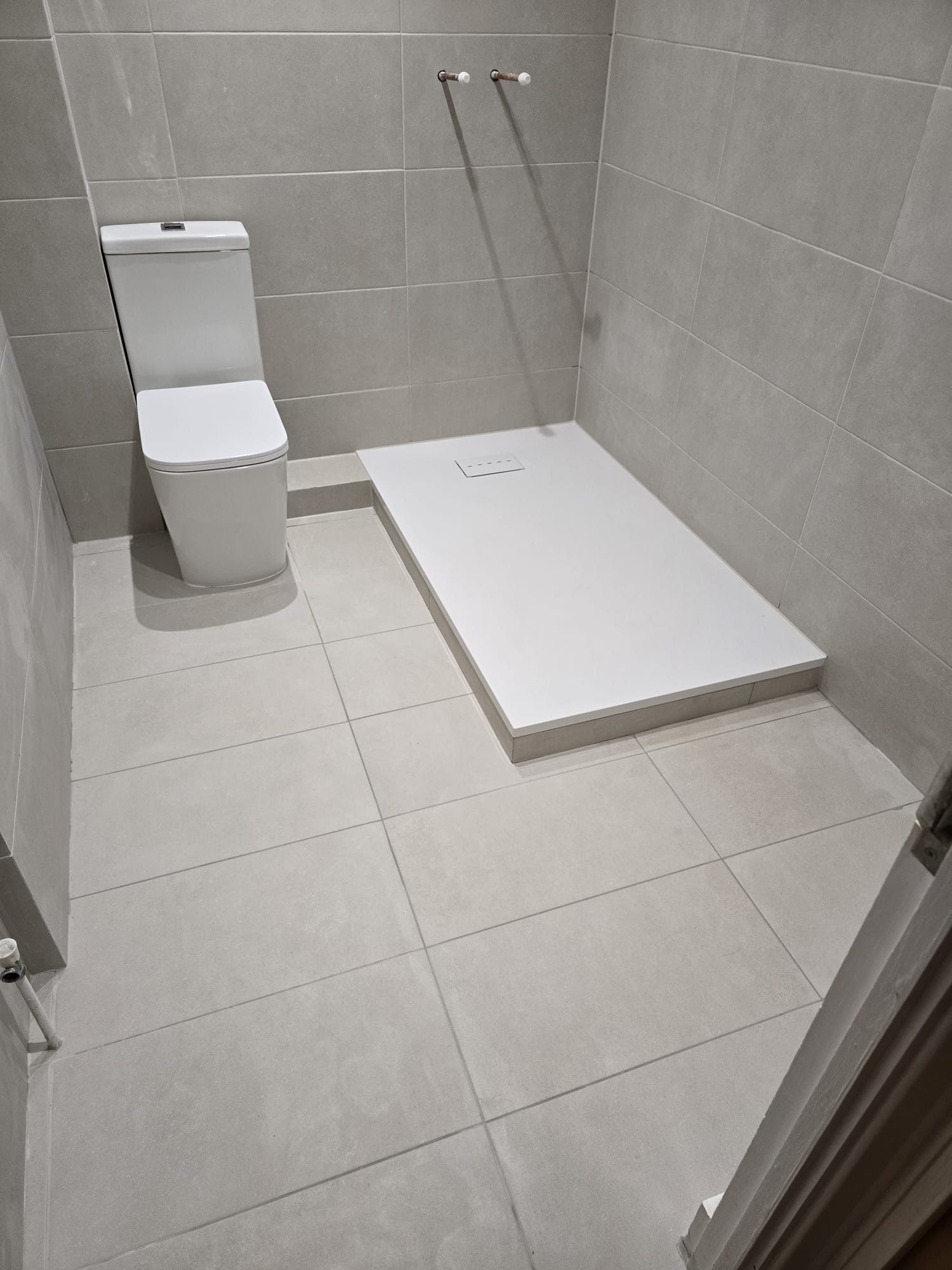 Bathroom shower tray installation in progress