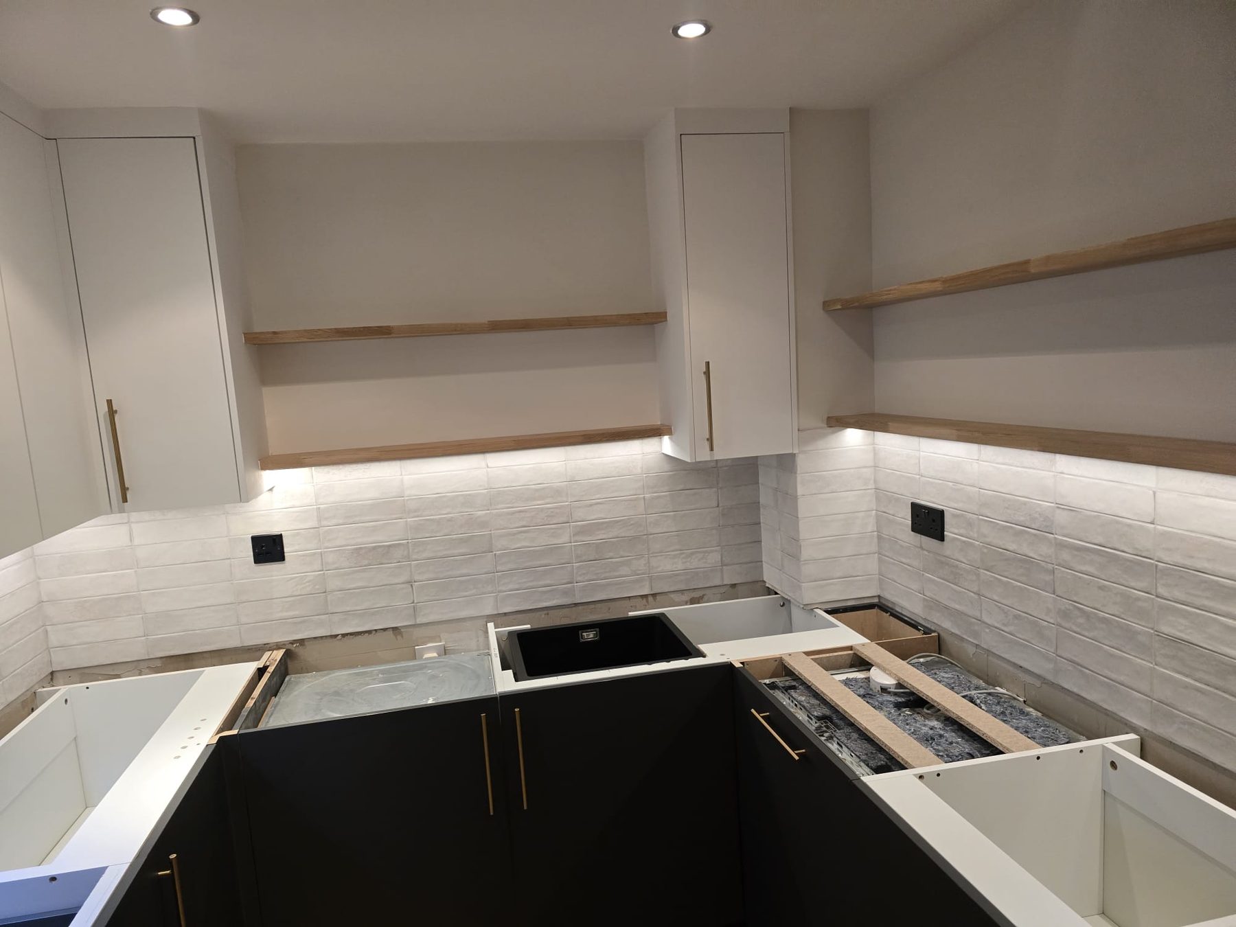 Kitchen cabinetry being fitted