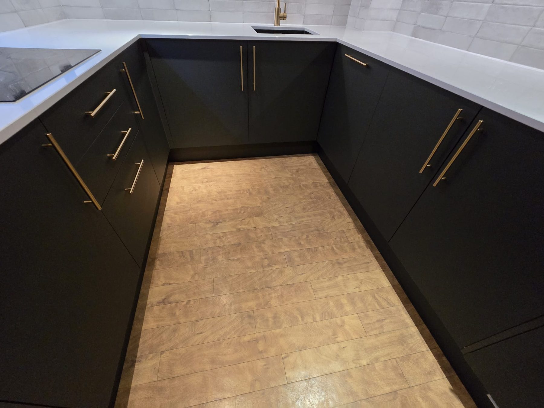 Finished kitchen floor and cabinet detail