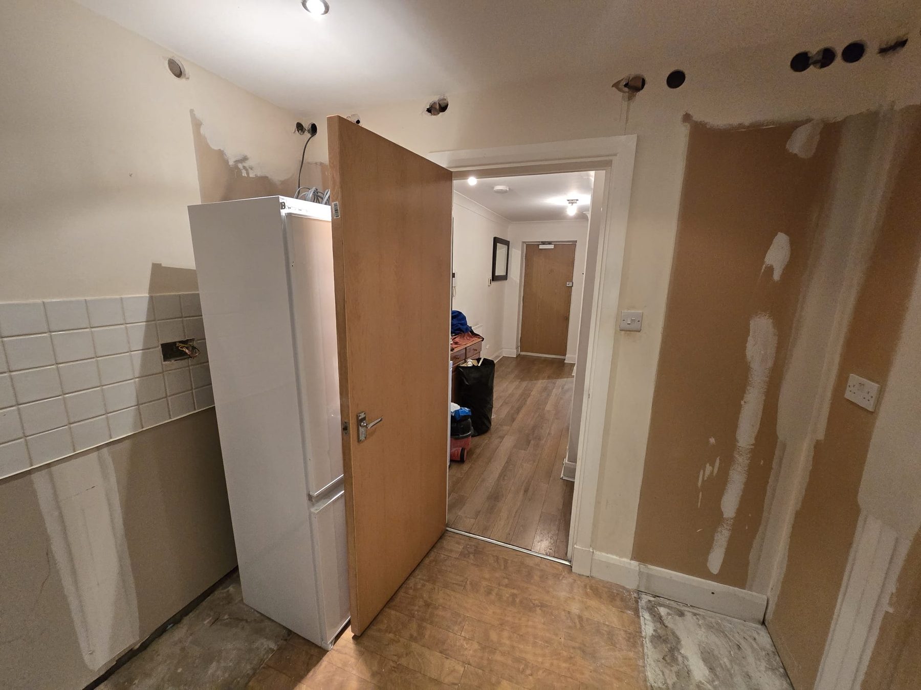 Kitchen stripped wall and flooring before refurbishment